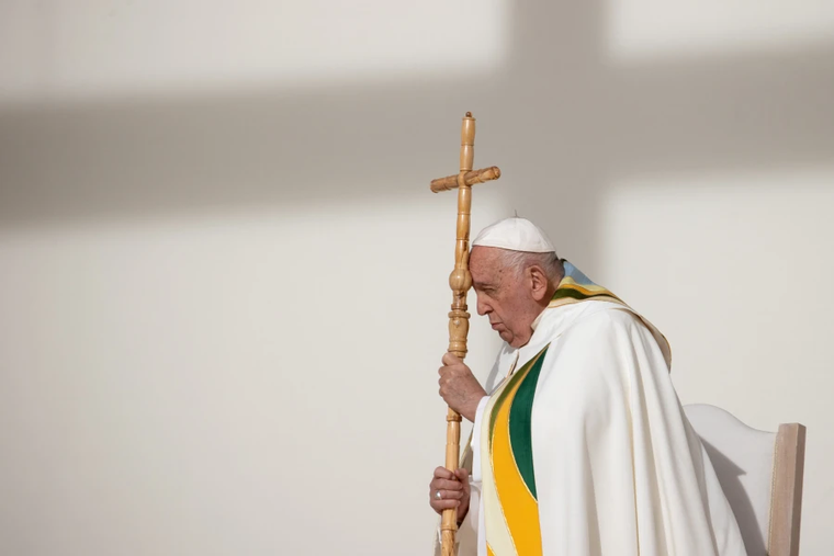Pope Francis prays during Mass at King Baudouin Stadium in Brussels, Belgium, Sunday, Sept. 29, 2024.
