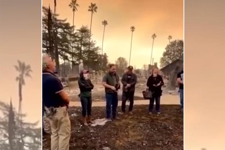 Peter and Jackie Halpin, joined by their six adult children and four of their spouses, sing the ‘Regina Caeli’ Jan. 9 at the site of their home, which was destroyed in the Eaton Fire, in the Altadena area of Los Angeles.