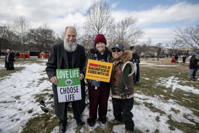 Pardoned by President Trump and released from jail just hours before, Joan Andrews Bell (center) arrived at the March for Life rally with her husband Chris and son Emiliano Bell.