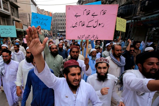 Supporters of a religious group march during a rally in support of Khalid Khan, who killed a man accused of blasphemy, in Peshawar on July 31, 2020.