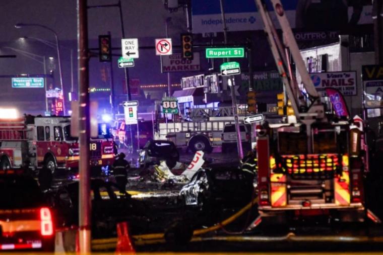 Emergency service members respond to a plane crash in a neighborhood near Cottman Avenue on Jan. 31, 2025, in Philadelphia. The plane, a medical transport jet carrying a child patient, crashed after taking off from Northeast Philadelphia Airport.