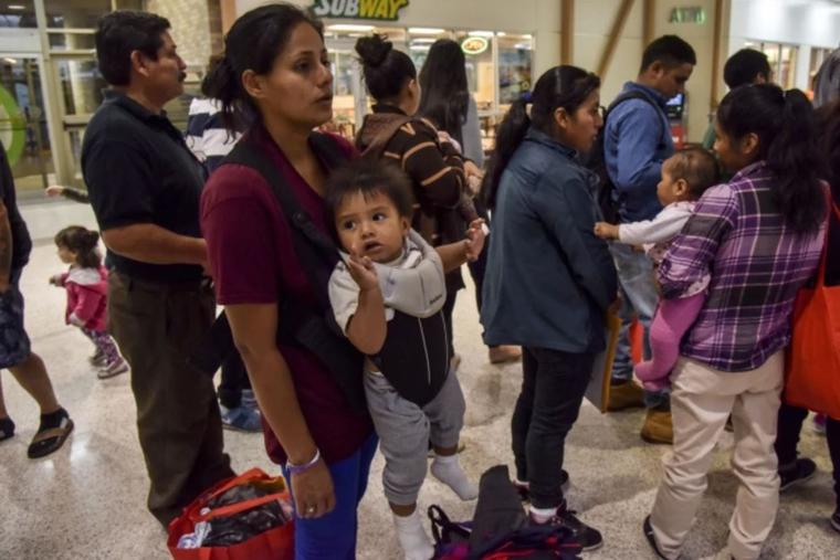 After receiving assistance from the Catholic Charities RGV Humanitarian Respite Center, migrant families from Mexico and Central America who have been granted asylum in the United States are processed for their transport to various destinations across the United States from the Central Station Bus Terminal on June 19, 2018, in McAllen, Texas.