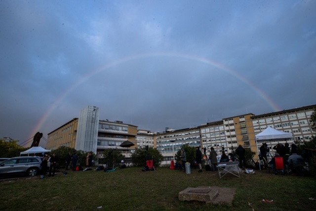 A rainbow appears above the Gemelli hospital where Pope Francis is hospitalized for tests and treatment for bronchitis in Rome on Feb. 18, 2025.