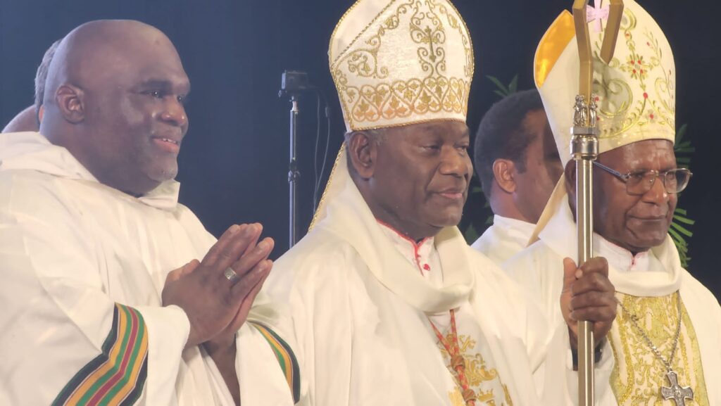 Deacon Harold Burke-Sivers celebrates Mass alongside Catholic clergy.