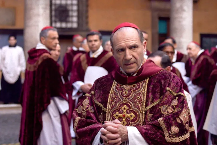 Ralph Fiennes portrays Cardinal Lawrence in the film “Conclave”
