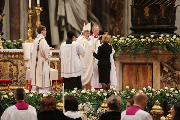 Pope Francis administers confirmation during the Easter Vigil Mass in St. Peter's Basilica, April 4, 2015.