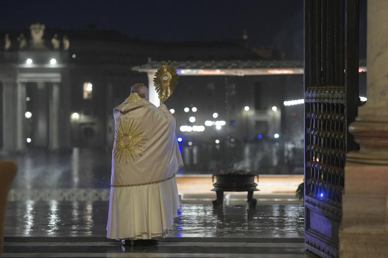 Pope Francis gives a blessing with the monstrance from the entrance of St. Peter's Basilica, during a televised holy hour with Eucharistic adoration and an extraordinary Urbi et Orbi blessing in response to the coronavirus pandemic, March 27, 2020.