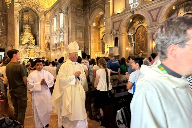 Archbishop Alexander Sample of Portland, Oregon, processes out of the Church of Our Lady of Providence after Mass during a Rise Up Encounter of World Youth Day in Lisbon, Portugal, on Aug. 4, 2023.
