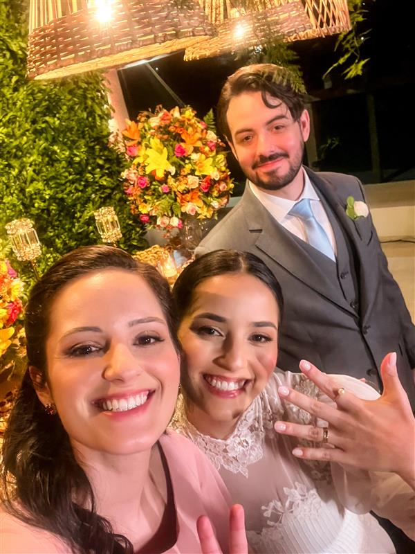 The author sneaks a selfie with the newly married couple.