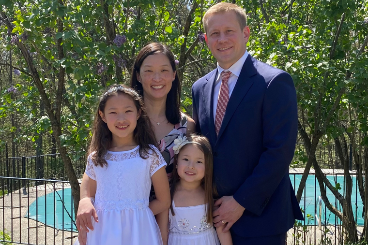 Tomaszewski family photo shows Jane and Dan with their daughters, Gigi and Marian, on Gigi’s first Communion day in 2023.