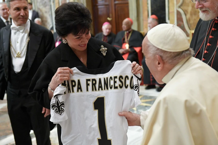 A member of the Papal Foundation greets Pope Francis with a personalized New Orleans Saints jersey, Friday, April 12, 2024.