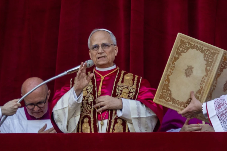 Pope Leo XIV waves to pilgrims in St. Peter’s Square shortly after his election on Thursday, May 8, 2025.