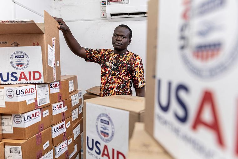 Pharmacist Joseph Njer Airo inspects boxes of antiretroviral drugs labeled "USAID," from the last donation before the funding cuts inside the medical stockroom of Migosi Sub-county Hospital on April 24, 2025 in Kisumu, Kenya. Kisumu has one of the highest HIV rates in Kenya, with around 17.6% of the adult population are living with the virus, nearly five times the national average of 4.5%. In 2025, Kisumu has become a focal point of a growing healthcare crisis, as funding cuts from the United States Agency for International Development (USAID) ripple through the local health system.