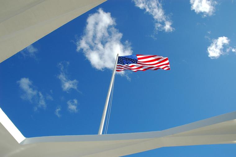 American flag flies over the USS Arizona Memorial at Pearl Harbor, Hawaii.
