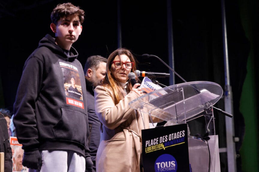 Ayelet Samerano (R), mother of Yonathan Samerano held hostage, addresses a speech during a gathering to support the hostages held in the Gaza Strip since Hamas' October 7, 2023 attack on Israel, in Paris on January 18, 2025. Israel's cabinet convened to vote on a Gaza ceasefire and hostage release deal that should take effect this weekend, Israeli Prime Minister's office said. (Photo by GEOFFROY VAN DER HASSELT / AFP) (Photo by GEOFFROY VAN DER HASSELT/AFP via Getty Images)