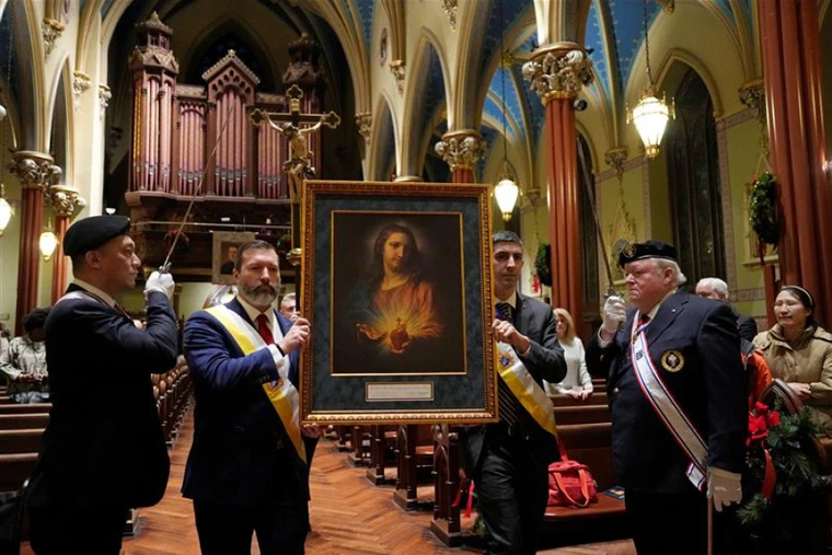Knights of Columbus process with the new Knights of Columbus Sacred Heart Pilgrim Icon during a Mass and Sacred Heart Holy Hour at St. Mary Church in New Haven, Connecticut, Jan. 3, 2025.