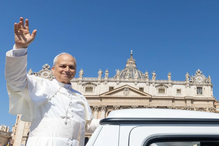 Pope Leo XIV waves from the popemobile at the crowds gathered in St. Peter's Square for Mass on Pentecost Sunday on June 8, 2025.