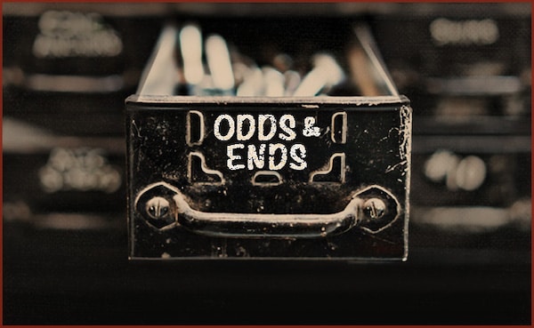 A vintage metal box labeled "Odds & Ends" with a blurred background, photographed on April 14, 2023.