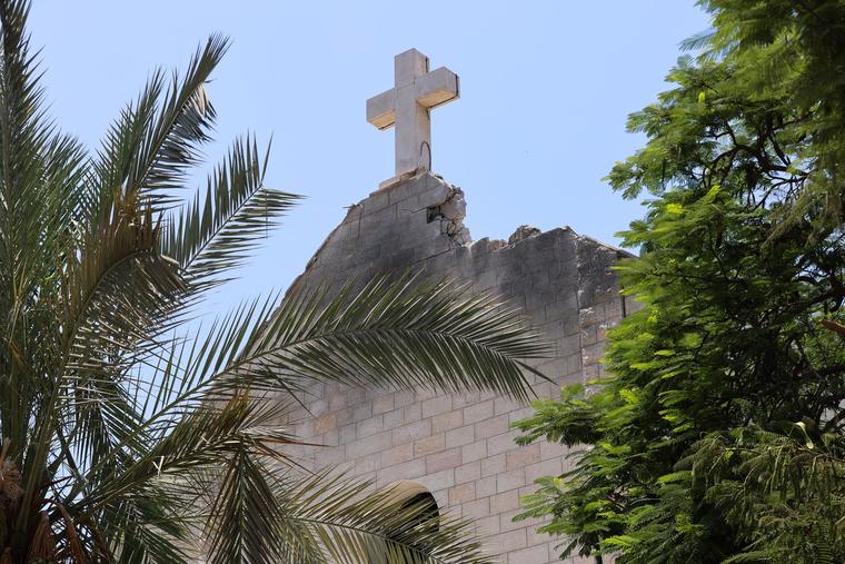 A view is seen of the damaged facade of Holy Family Church, on July 18, a day after the church was hit in an Israeli strike, in Gaza City.