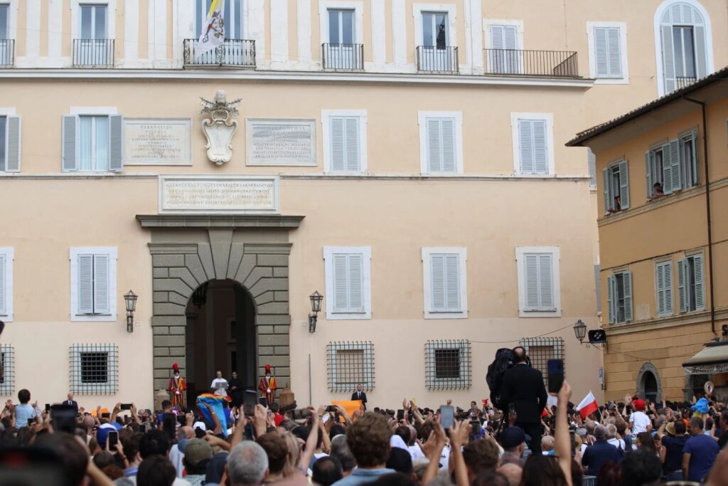 The sun burst through rain drops right as Pope Leo appeared in front of the apostolic palace of Castel Gandolfo to give the Angelus address on July 13, 2025. Credit: Hannah Brockhaus/CNA