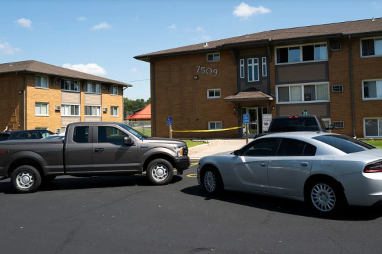 Law enforcement vehicles sit parked outside a reported residence of the shooter following a mass shooting at Annunciation Catholic School on Aug. 27, 2025, in Richfield, Minnesota.