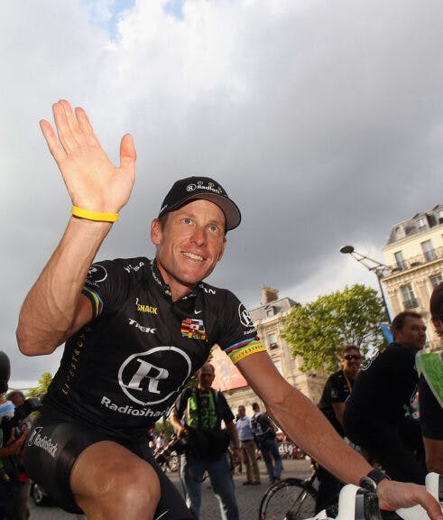 PARIS - JULY 25: Lance Armstrong of team Radioshack waves to fans after the twentieth and final stage of Le Tour de France 2010, from Longjumeau to the Champs-Elysees in Paris on July 25, 2010 in Paris, France. (Photo by Bryn Lennon/Getty Images)