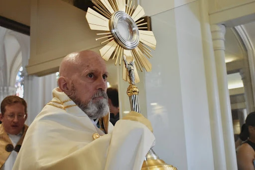 Archbishop Samuel J. Aquila of Denver holds the monstrance at the beginning of a Eucharistic procession in downtown Denver in 2024. Credit: Kate Quiñones/CNA