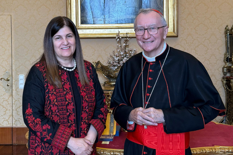 Cardinal Pietro Parolin stands beside Varsen Aghabekian, the foreign minister of Palestinian Authority during a meeting on Sept. 1 at the Vatican.