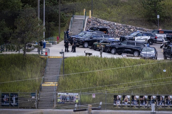 Police officers are on the scene at Evergreen High School where a shooting occured earlier in the day, in Evergreen, Colorado, on Sept. 10, 2025. A shooting at Evergreen High School in Colorado critically injured three studentsincluding the suspected shooter. Authorities say there is no longer an active threat.