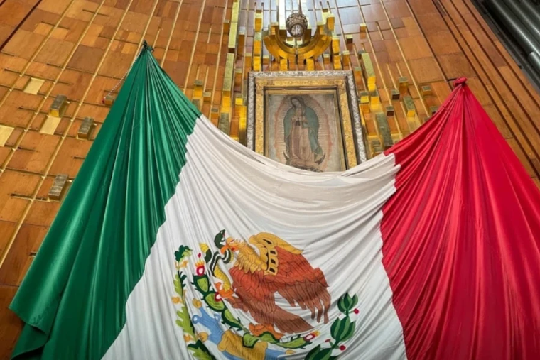 The original image of Our Lady of Guadalupe with the Mexican flag.