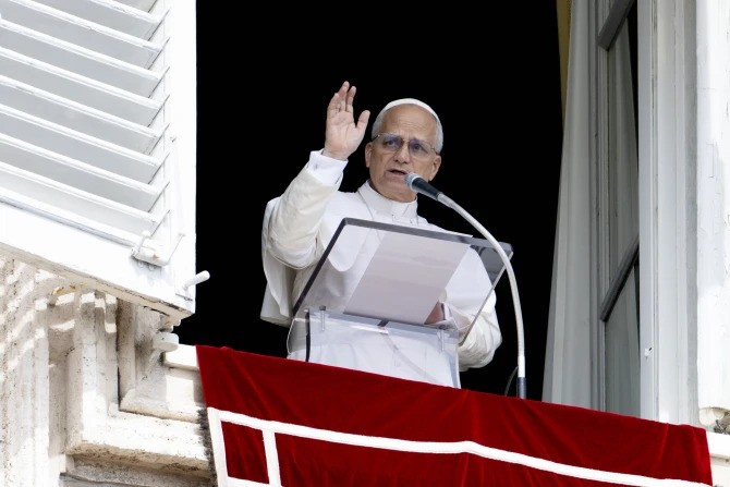 Pope Leo XIV waves to pilgrims gathered for his Sunday Angelus in St. Peter’s Square at the Vatican on Sept. 14, 2025.