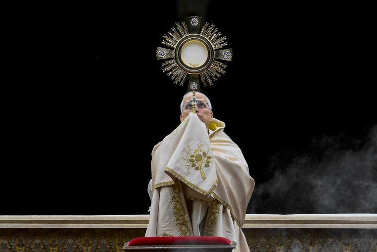 Pope Leo raises the Eucharist in a monstrance in St. Peter’s Square during the prayer vigil and Rosary for peace on Oct. 11, 2025.