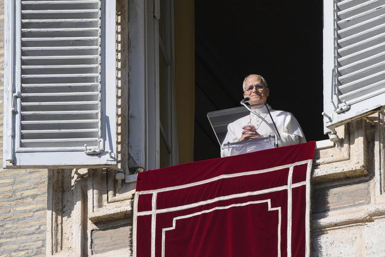 Pope Leo XIV looks out at pilgrims gathered in St. Peter’s Square at the Vatican for the Angelus on Dec. 7, 2025.