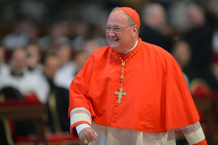 Cardinal Timothy Dolan visits St. Peter's Basilica before the conclave on March 12, 2013, at the Vatican.