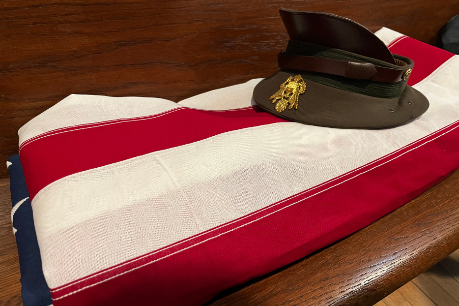 Jimmy Boehling's American flag and service hat rest in a pew at Saint Benedict Church, Wednesday, Jan. 14, 2026