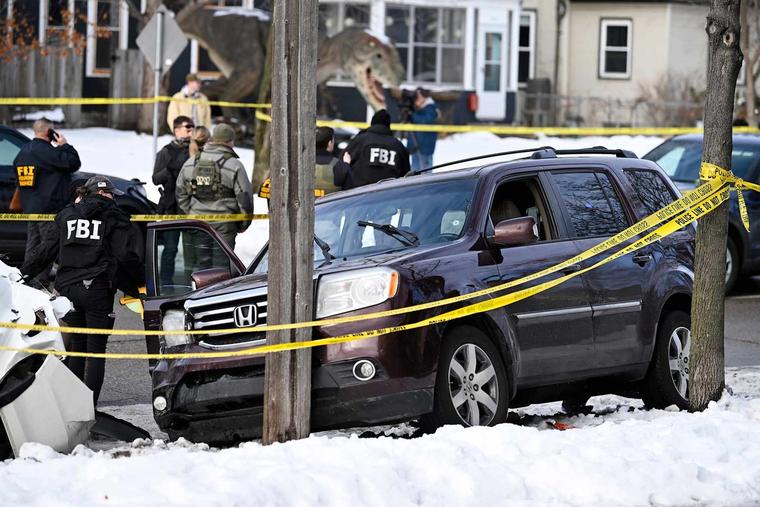 Members of law enforcement work the scene following a suspected shooting by an ICE agent during federal law enforcement operations on January 07, 2026 in Minneapolis, Minnesota.