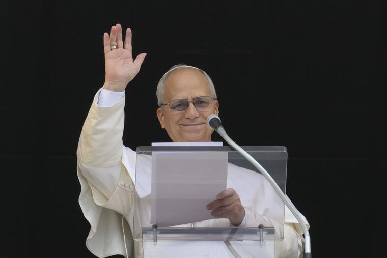 Pope Leo waves to the faithful as he gives his Angelus address on Feb. 8, 2026.