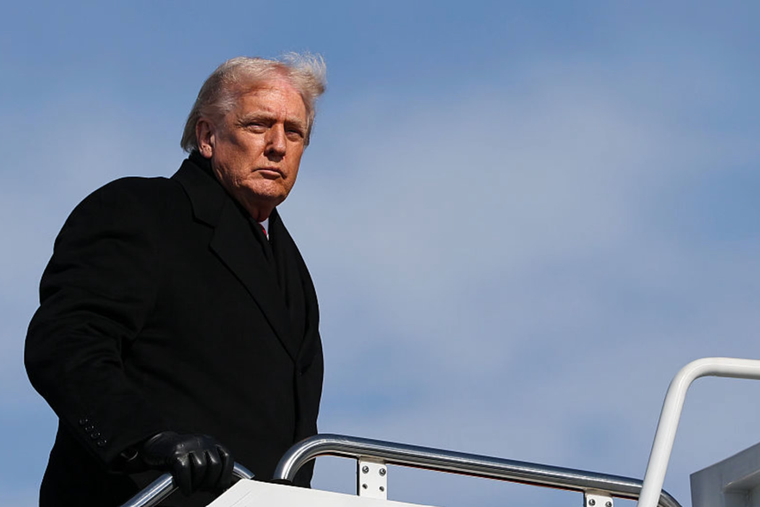 U.S. President Donald Trump boards Air Force One on Jan. 27, 2026.