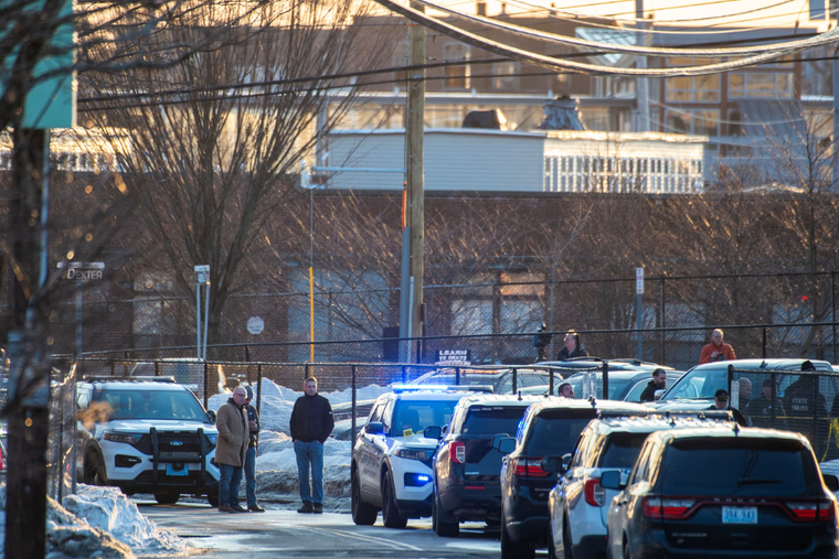 Police stand outside the perimeter they created around the Dennis M. Lynch Arena where a shooting occurred in Pawtucket, Rhode Island, Monday, Feb. 16, 2026.