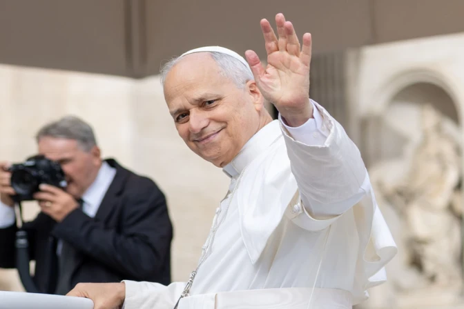 Pope Leo XIV waves to pilgrims in St. Peter’s Square at the Vatican.