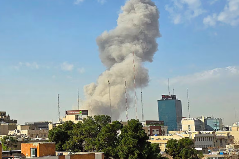 A plume of smoke rises after an explosion on Saturday, Feb. 28, 2026, in Tehran, Iran. After explosions were seen in the Iranian capital, the office of the Israeli Defense Minister issued a statement saying it had launched a preemptive strike against the country.