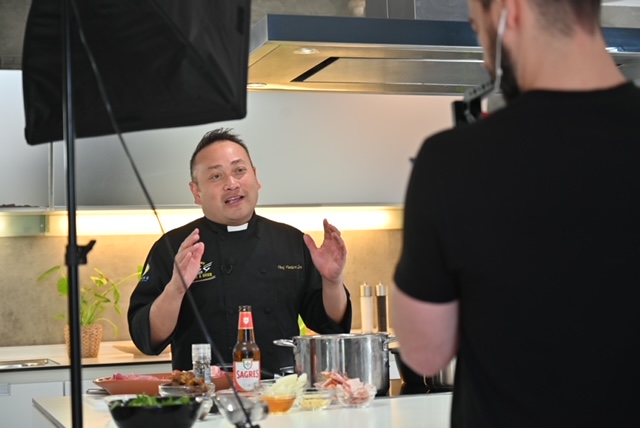 EWTN's Father Leo Patalinghug speaks on camera while filming content for his social media channels.