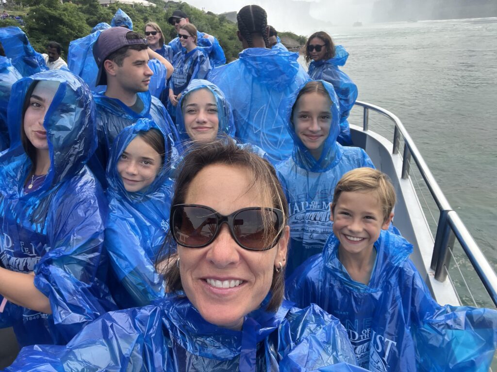 Andrea Picciotti-Bayer poses with her family on a boat visiting Niagara Falls.