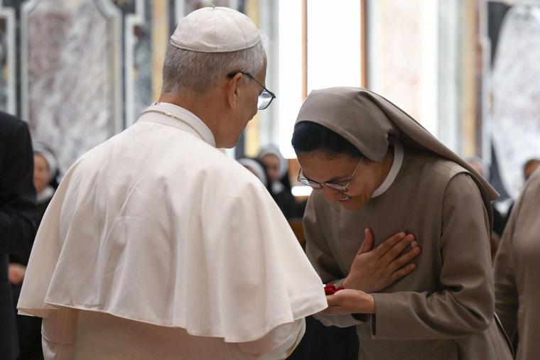 Pope Leo XIV greets a woman religious during an audience with members of the Sisters of the Order of St. Basil the Great, the Daughters of Divine Charity, the Augustinian Sisters of the Amparo, and the Franciscan Sisters of the Sacred Hearts, on June 30, 2025, at the Vatican.
