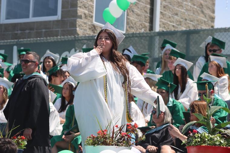 Sheridan Gorman walks across the stage during the graduation ceremony for Yorktown High School at Charlie Murphy Field, Yorktown, New York, Saturday, June 21, 2025.