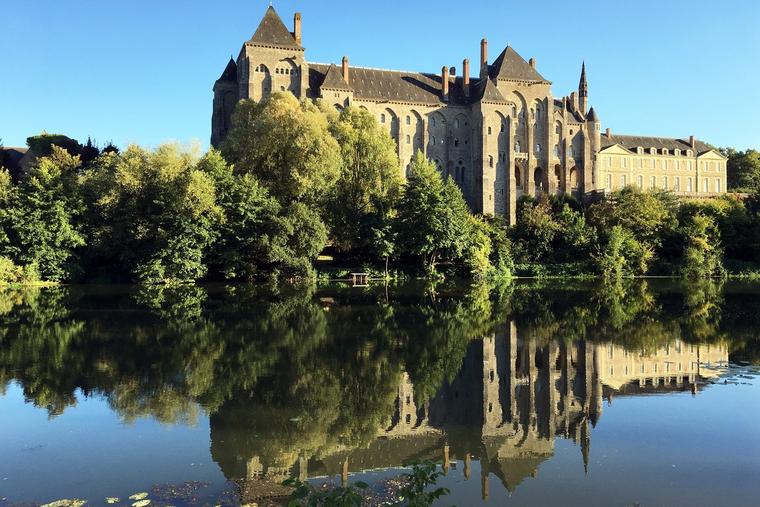 The Benedictine Abbey of Solesmes stands along the Sarthe River in France.