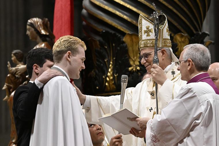 Pope Leo welcomes a new Catholic at the Easter vigil, April 4, 2026, at the Vatican.