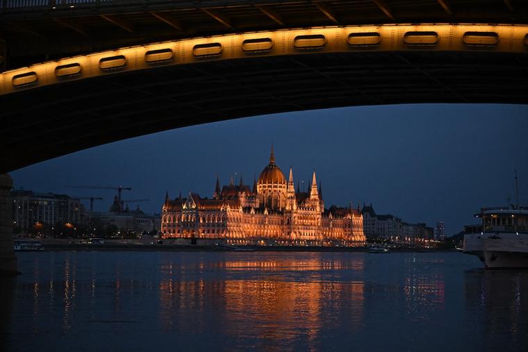 The Hungarian Parliament building, the iconic symbol of the Hungarian capital of Budapest, is seen with the Margaret Bridge illuminated on April 10, 2026, two days before the general election in Hungary.