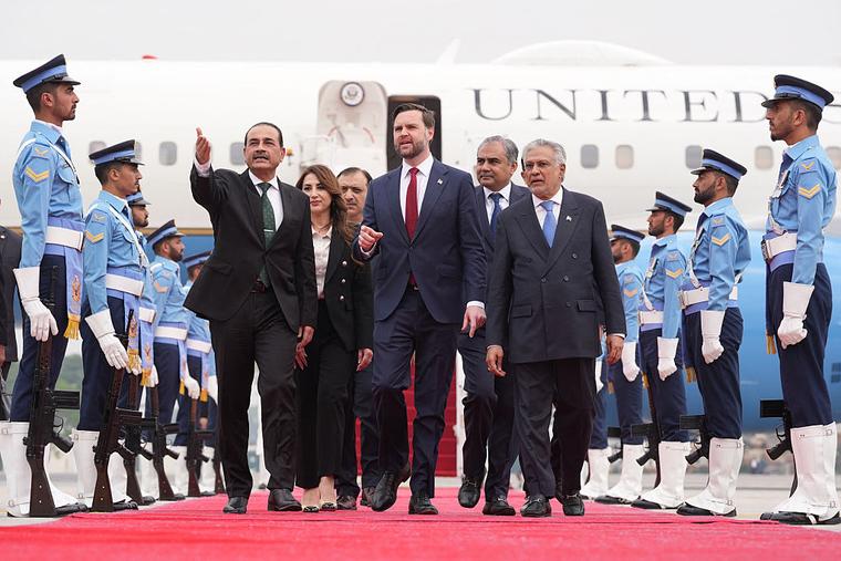 US Vice President JD Vance (C) walks with Pakistan's Chief of Defense Forces and Chief of Army Staff Field Marshall Asim Munir (L) and Pakistani Deputy Prime Minister and Foreign Minister Mohammad Ishaq Dar after arriving for talks with Iranian officials in Islamabad on April 11, 2026.
