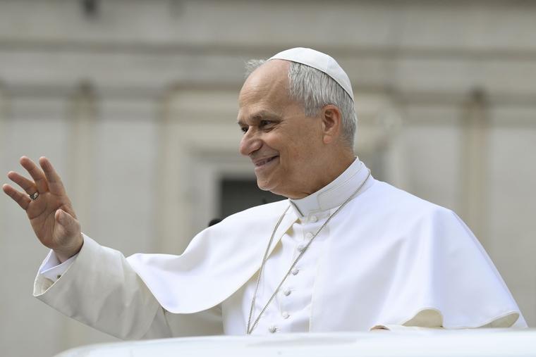 Pope Leo waves to the faithful at his May 6, 2026, general audience.